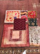 A GROUP OF 7 ASSORTED MAINLY EASTERN HAND CRAFTED NEEDLEWORK PANELS TO INCLUDE SILK AND SHISHA