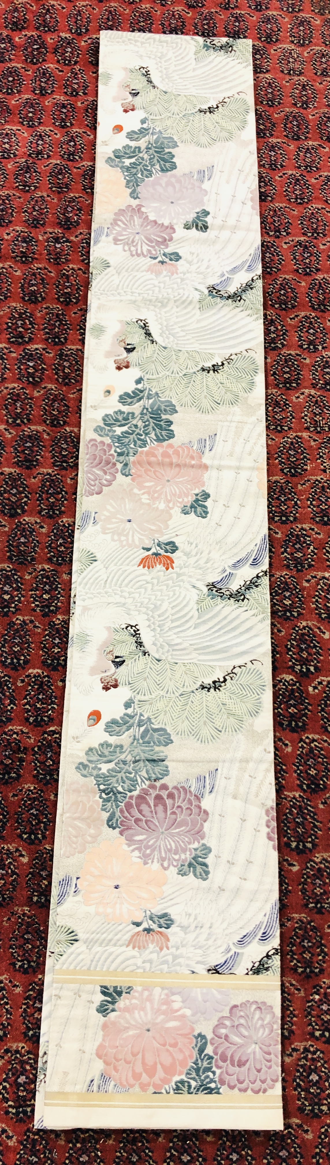 A CHINESE SILK "OBI" ON AN IVORY FIELD DECORATED WITH BIRDS AND FLOWERS. - Image 2 of 4