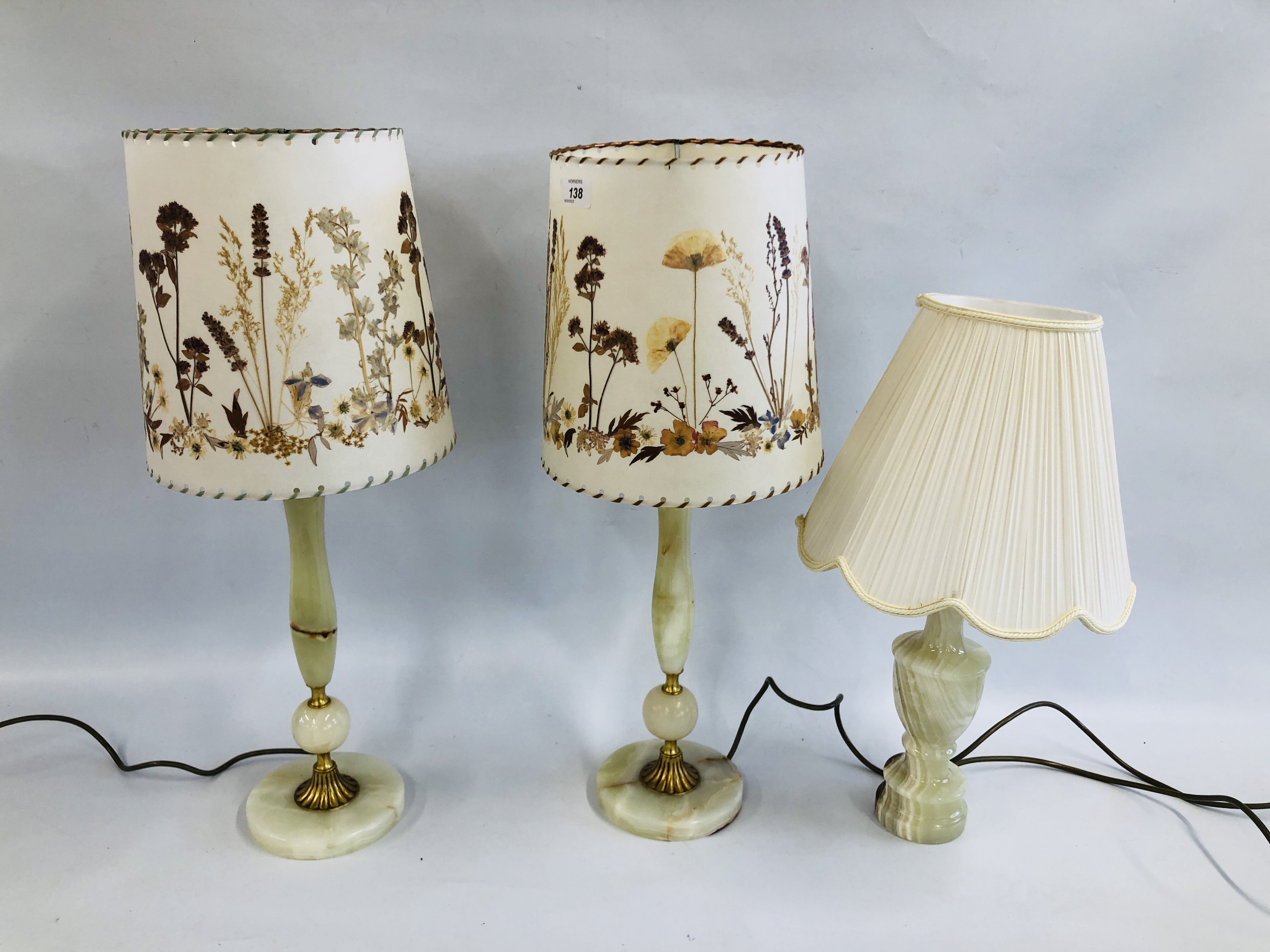 A GROUP OF THREE ONYX BASE TABLE LAMPS,