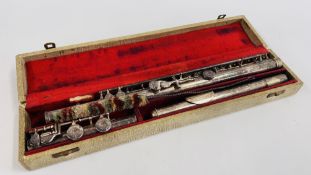 A VINTAGE FLUTE IN A FITTED CASE MARKED "F. BUISSON".