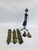 A GROUP OF HORSE BRASSES ON BLACK LEATHER STRAPS ALONG WITH A METAL CRAFT FIRESIDE SET.