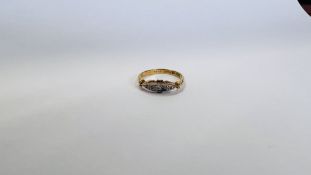 AN 18CT GOLD AND PLATINUM FOUR STONE DIAMOND RING OF NAVETTE DESIGN