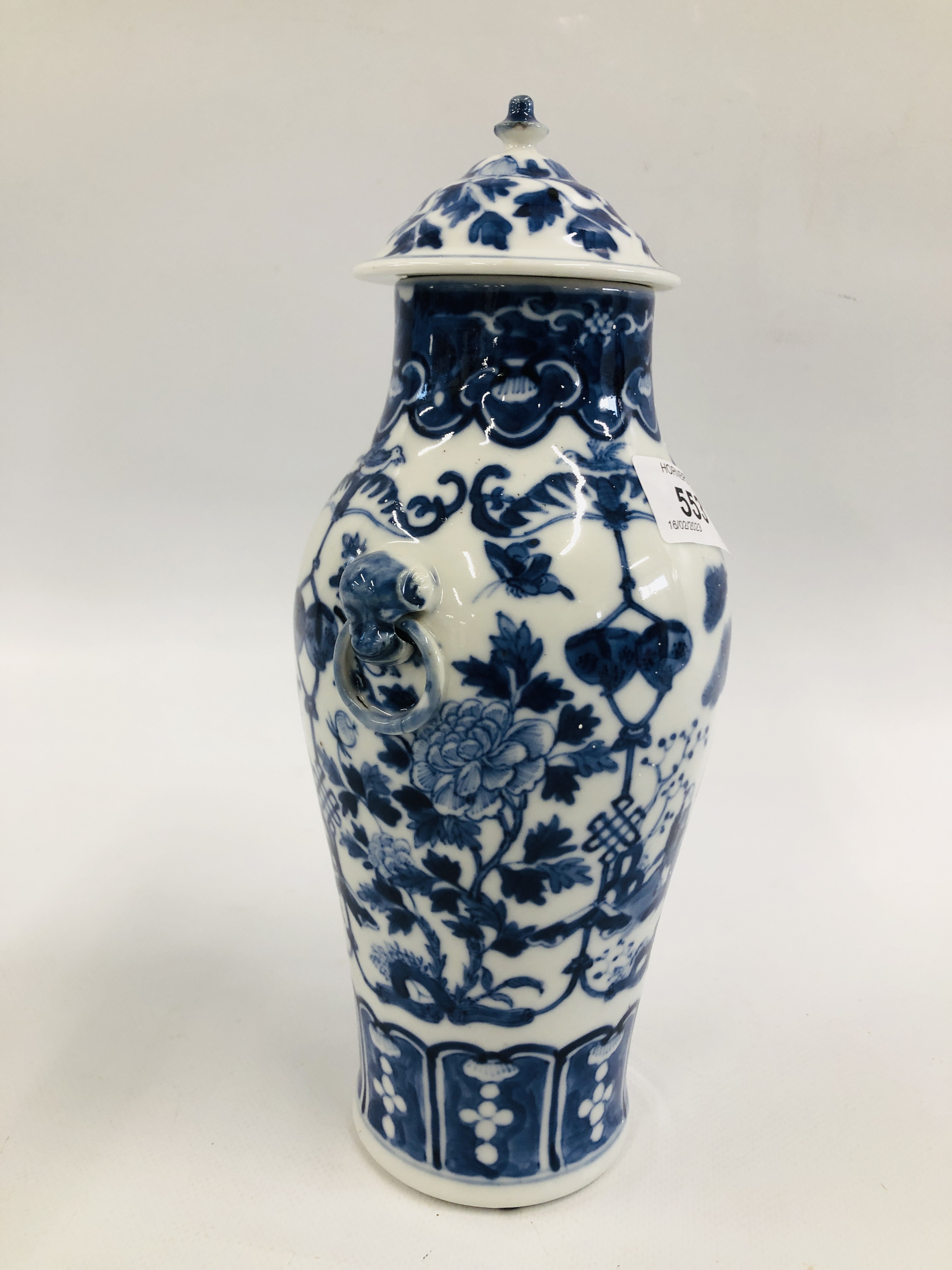 A PAIR OF ORIENTAL BLUE AND WHITE LIDDED URNS, DECORATED WITH FIGURES AND BLOSSOM, - Image 6 of 10