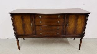 A REPRODUCTION MAHOGANY FINISH SHAPED FRONT SIDEBOARD - W 145CM. D 48CM. H 85CM.