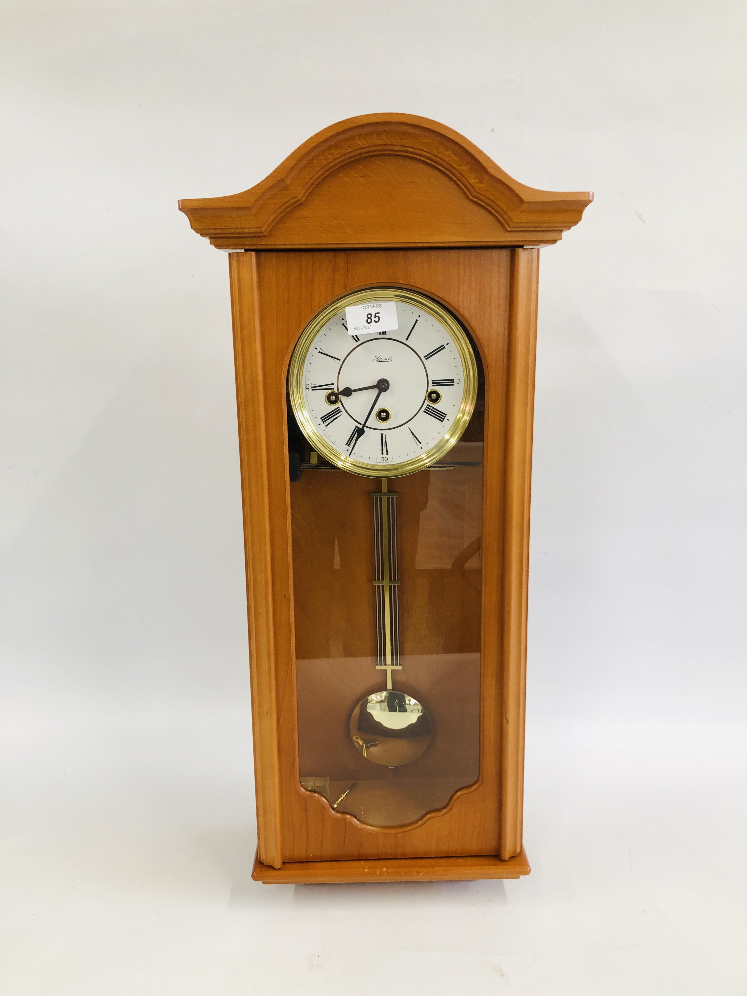 A HERMLE CHIMING WALL CLOCK.