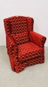 A MODERN WING BACK CHAIR UPHOLSTERED IN RED AND GOLD