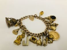 A YELLOW METAL CHARM BRACELET WITH 9CT GOLD PADLOCK CLASP,