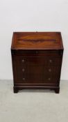 A REPRODUCTION MAHOGANY FINISH FOUR DRAWER BUREAU WITH FITTED INTERIOR - W 76CM. D 39CM. H 100CM.