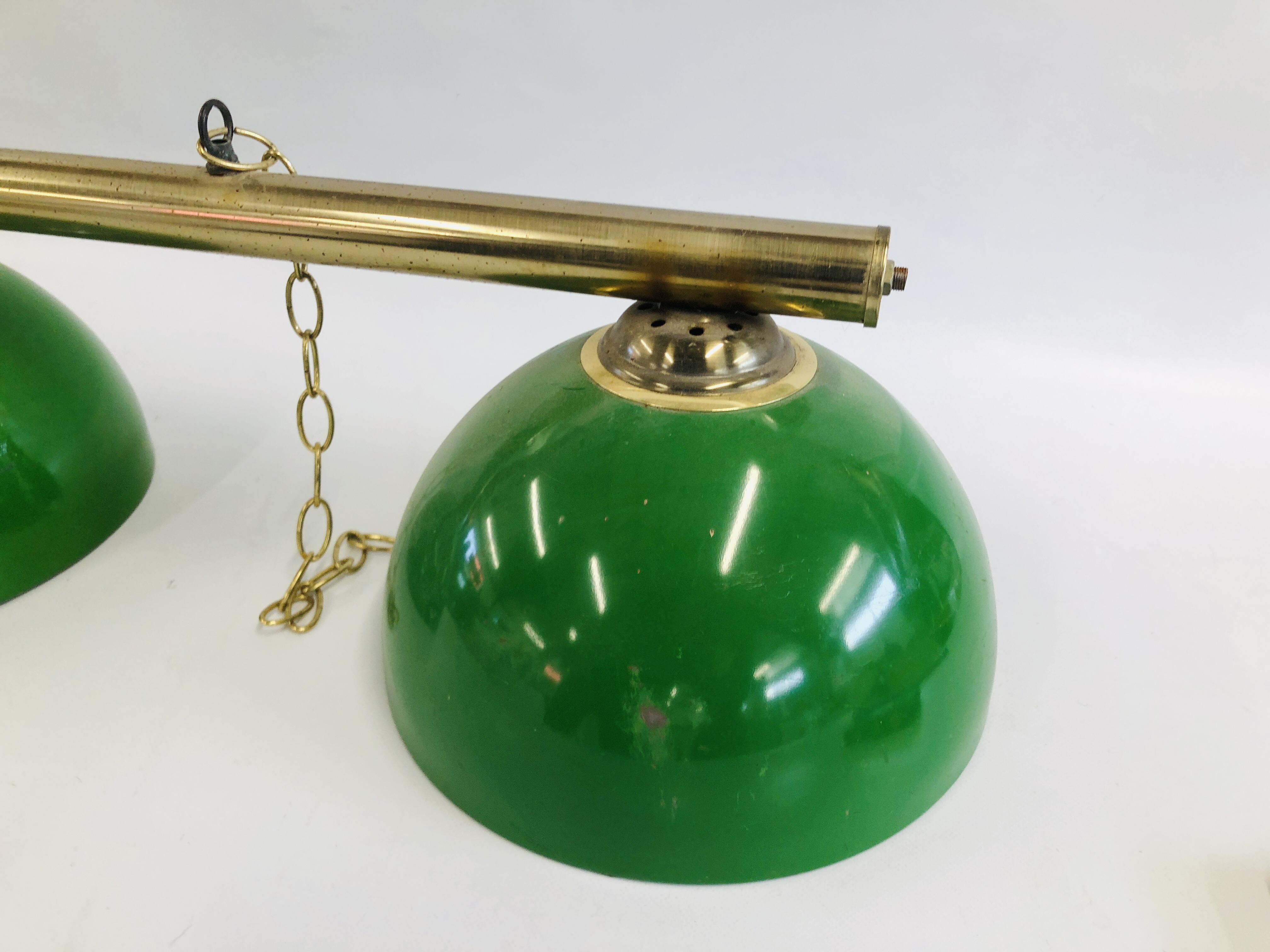 A VINTAGE STYLE CEILING SUSPENDED THREE BULB LIGHT BAR ON BRASS EFFECT TUBE AND GREEN SHADES - SOLD - Image 2 of 5