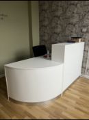 A WHITE FINISH RECEPTION DESK WITH CORNER ADD ON SECTION AND OFFICE CHAIR.