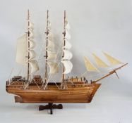 A LARGE WOODEN MODEL OF A SHIP L 110 CM. X H 85CM.