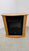 A MODERN DIMPLEX ELECTRIC FIRE IN OAK FINISH SURROUND - SOLD AS SEEN.