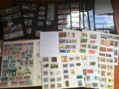 SMALL BOX STAMP COLLECTIONS IN ALBUMS AND LOOSE, WEST INDIES INCLUDING ST. VINCENT MINT SETS.