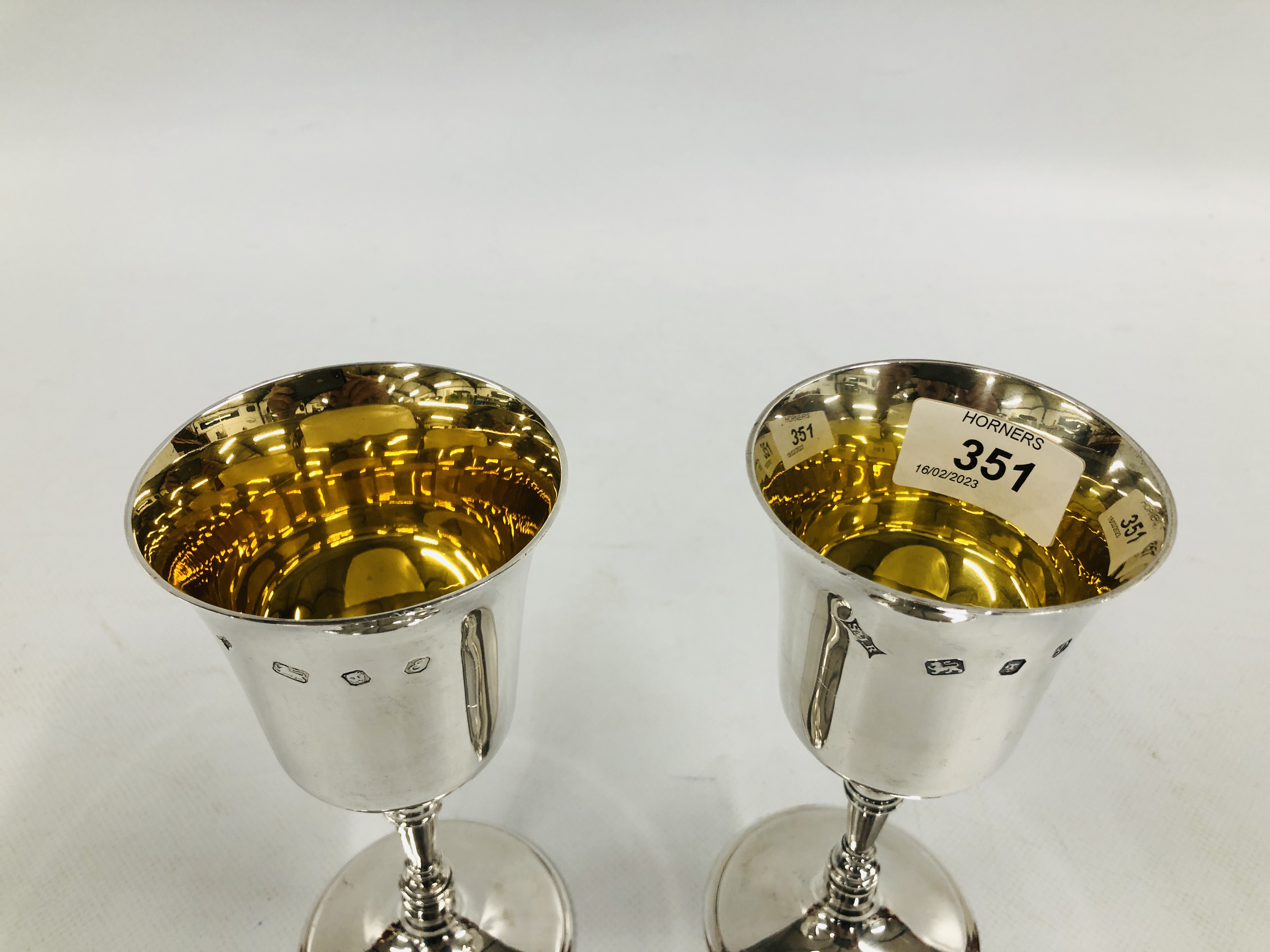 A PAIR OF SILVER AND GILT GOBLETS, LONDON ASSAY BEARING MAKERS INITIALS S.J.R. - H 16CM. - Image 2 of 8