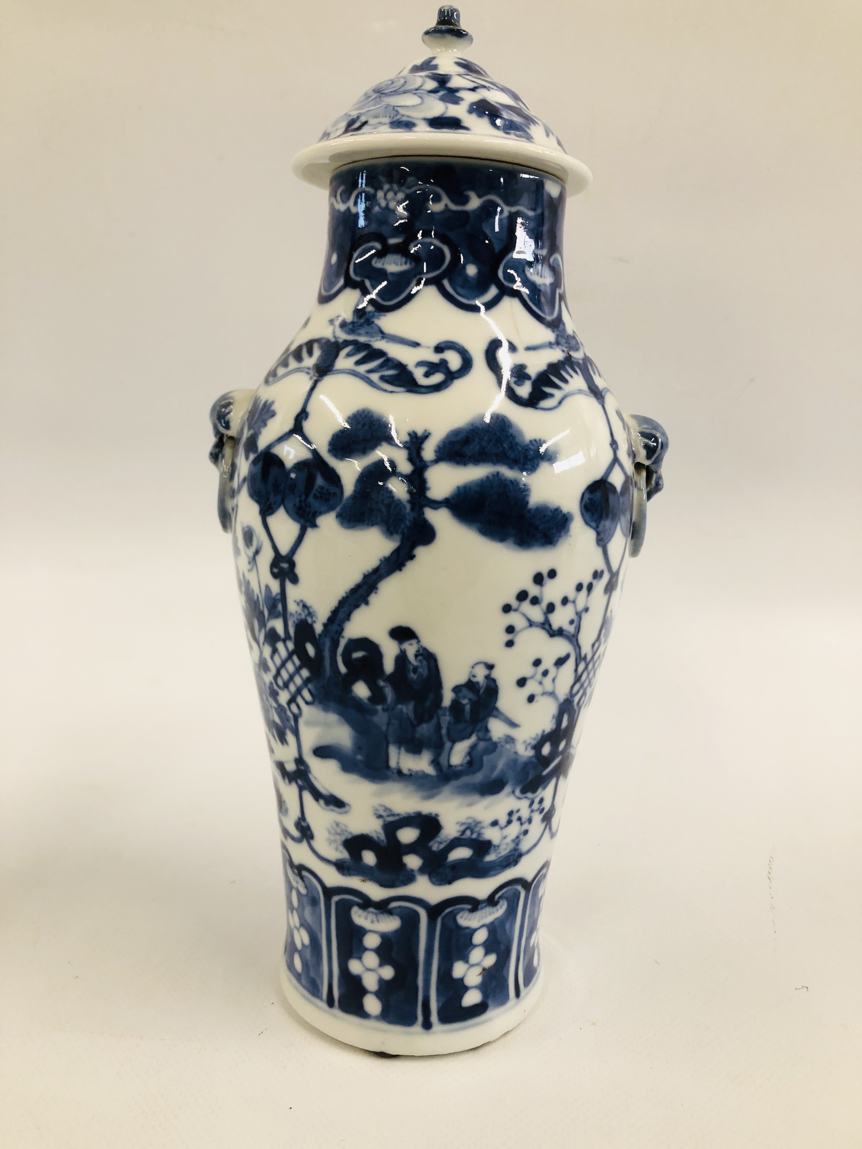 A PAIR OF ORIENTAL BLUE AND WHITE LIDDED URNS, DECORATED WITH FIGURES AND BLOSSOM, - Image 7 of 10