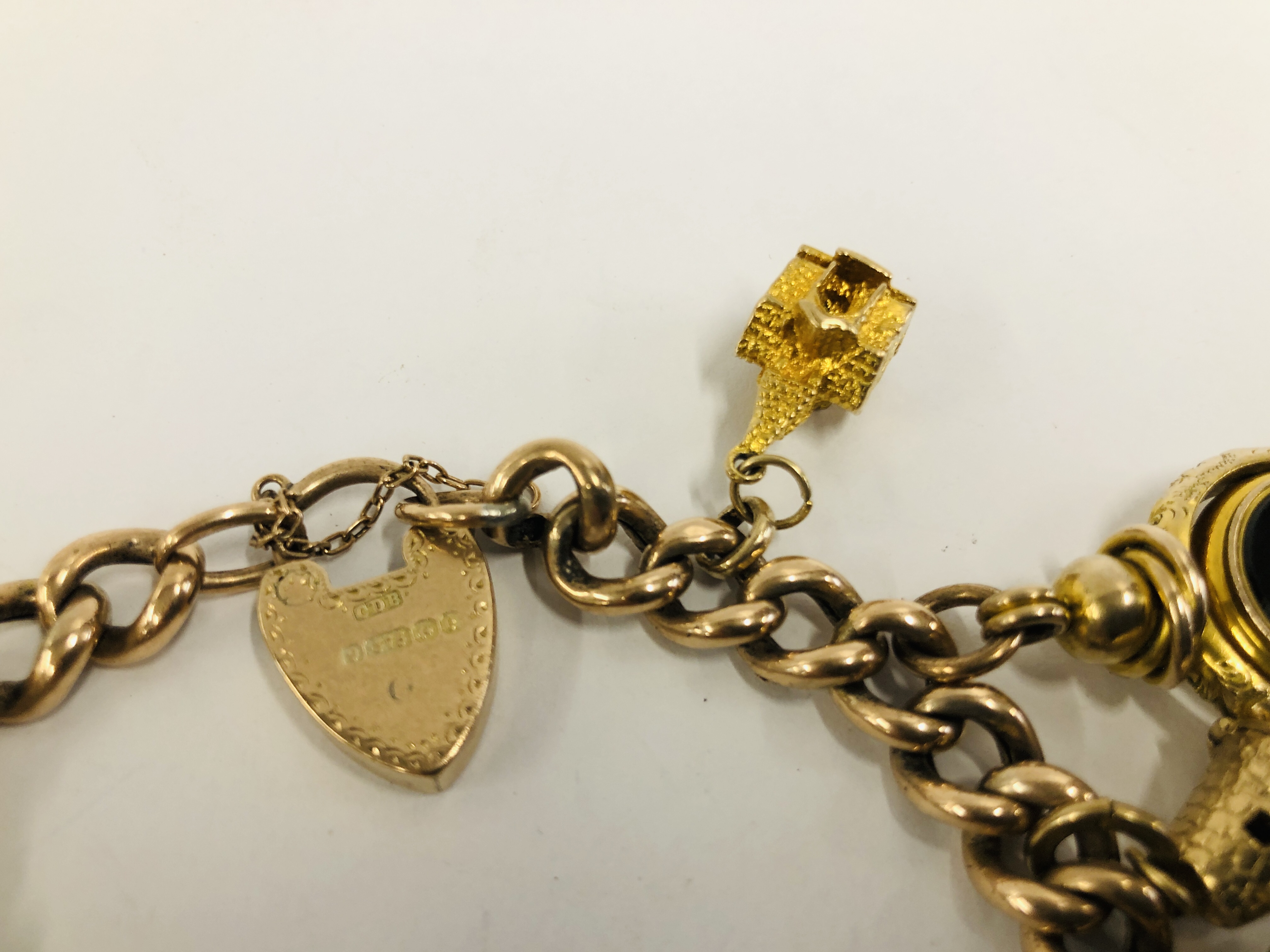A YELLOW METAL CHARM BRACELET WITH 9CT GOLD PADLOCK CLASP, - Image 6 of 9