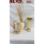 A MODERN CREAM FINISH VASE ON COLUMN BASE WITH GOLD DETAILING ALONG WITH A LARGE DECORATIVE FEMALE