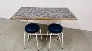 A METAL FRAMED BREAKFAST TABLE WITH BLUE MOSAIC TILED TOP AND TWO METAL FRAMED STOOLS WITH BLUE