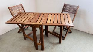 A SOLID HARDWOOD "IKEA" APPLARO FOLDING DROP LEAF GARDEN TABLE AND TWO MATCHING FOLDING CHAIRS.