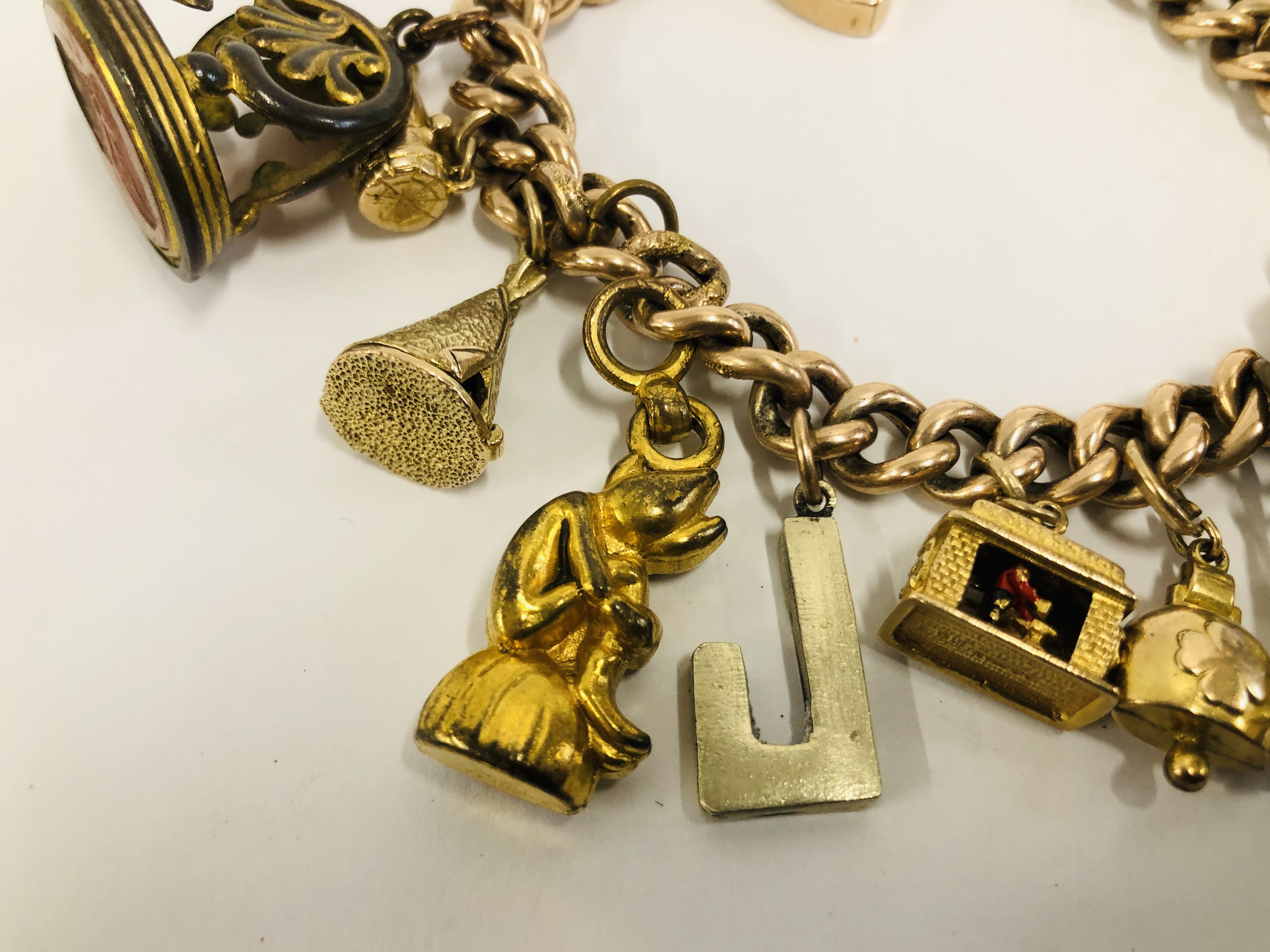 A YELLOW METAL CHARM BRACELET WITH 9CT GOLD PADLOCK CLASP, - Image 2 of 9