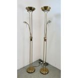 A PAIR OF MODERN BRASS EFFECT UPLIGHTERS WITH READING LIGHTS - SOLD AS SEEN.