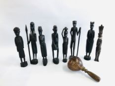A COLLECTION OF 7 ETHNIC HARDWOOD FIGURES + ONE OTHER AND A COCONUT SHAKER.