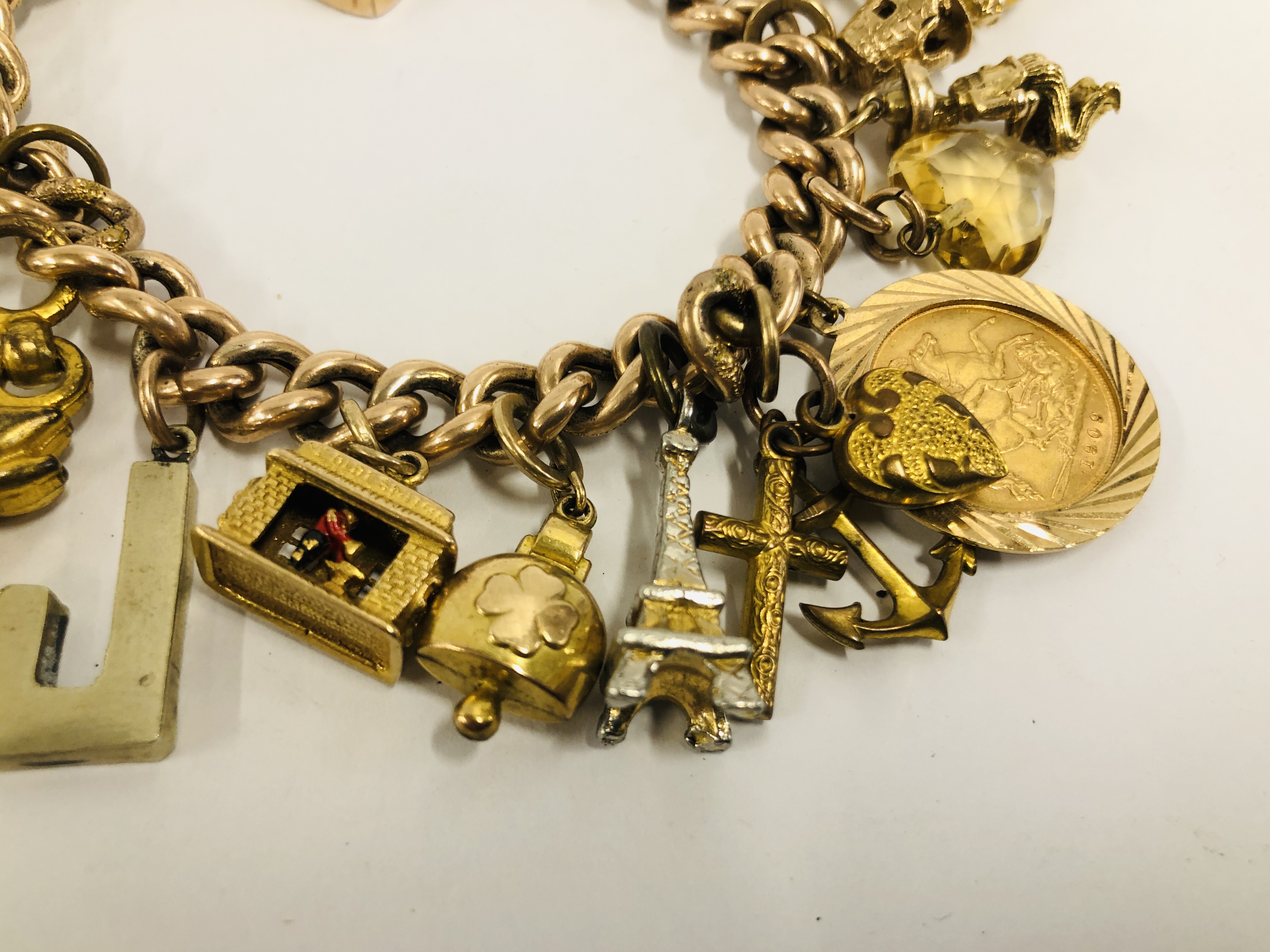 A YELLOW METAL CHARM BRACELET WITH 9CT GOLD PADLOCK CLASP, - Image 3 of 9