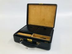 A BLACK LEATHERED JEWELLERY CASE MANUFACTURED FOR HARRODS.