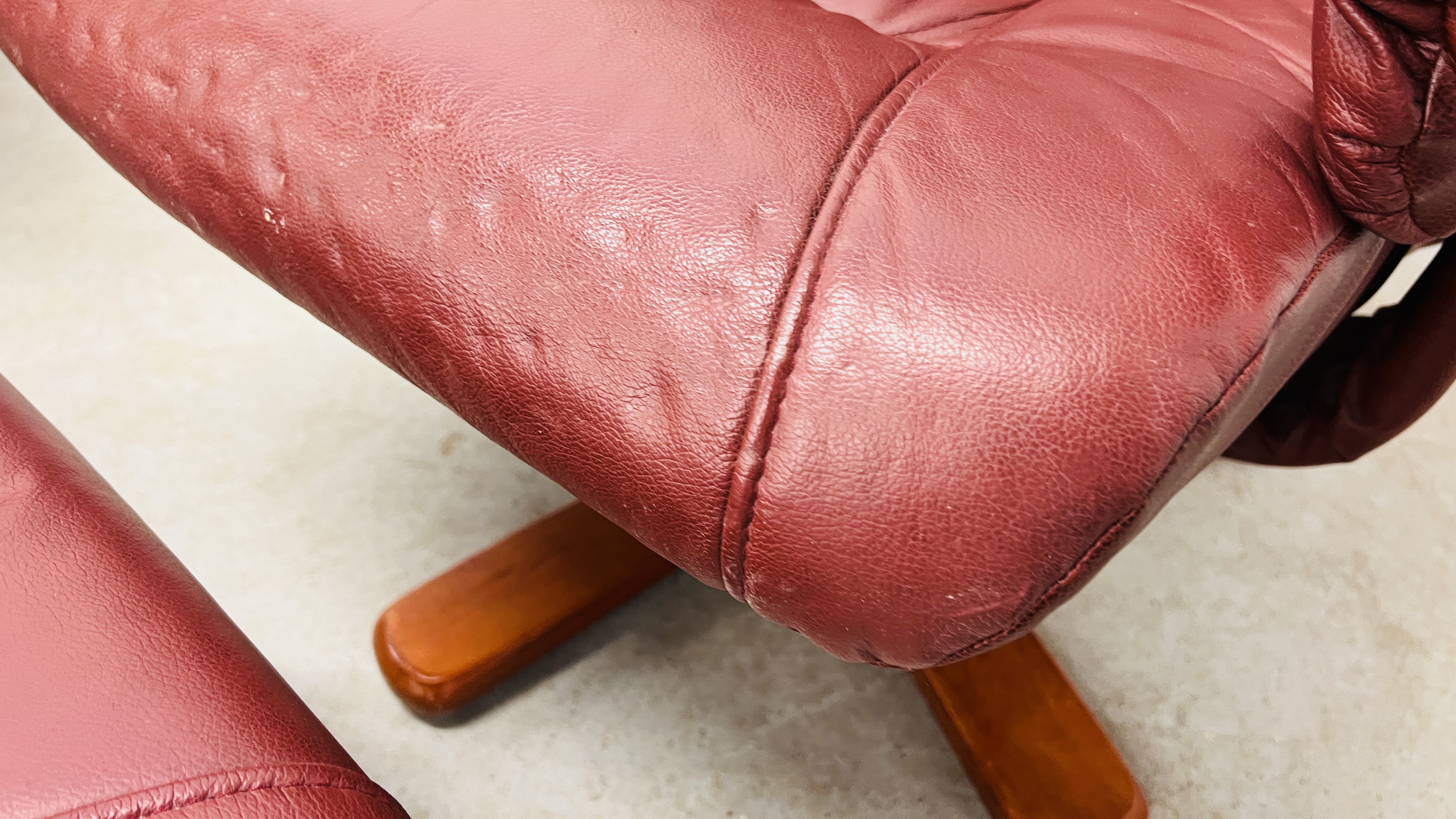 A PAIR OF RED LEATHER REVOLVING ARMCHAIRS WITH FOOTSTOOLS. - Image 16 of 25