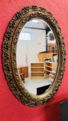 A C19TH GILT OVAL WALL MIRROR, 110CM HIGH.