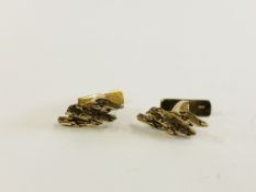 A PAIR OF 9CT GOLD CUFF LINKS OF BARK DESIGN BY C J LTD.