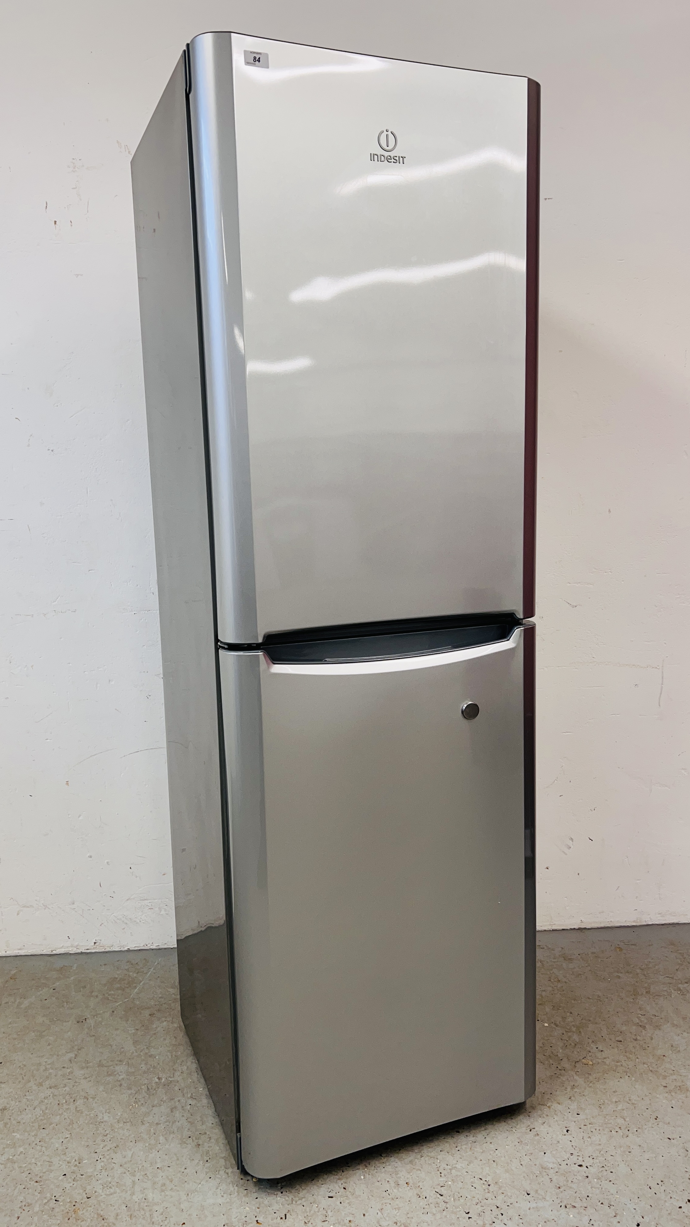 A INDISIT SILVER FINISH FRIDGE FREEZER - SOLD AS SEEN.