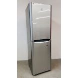 A INDISIT SILVER FINISH FRIDGE FREEZER - SOLD AS SEEN.