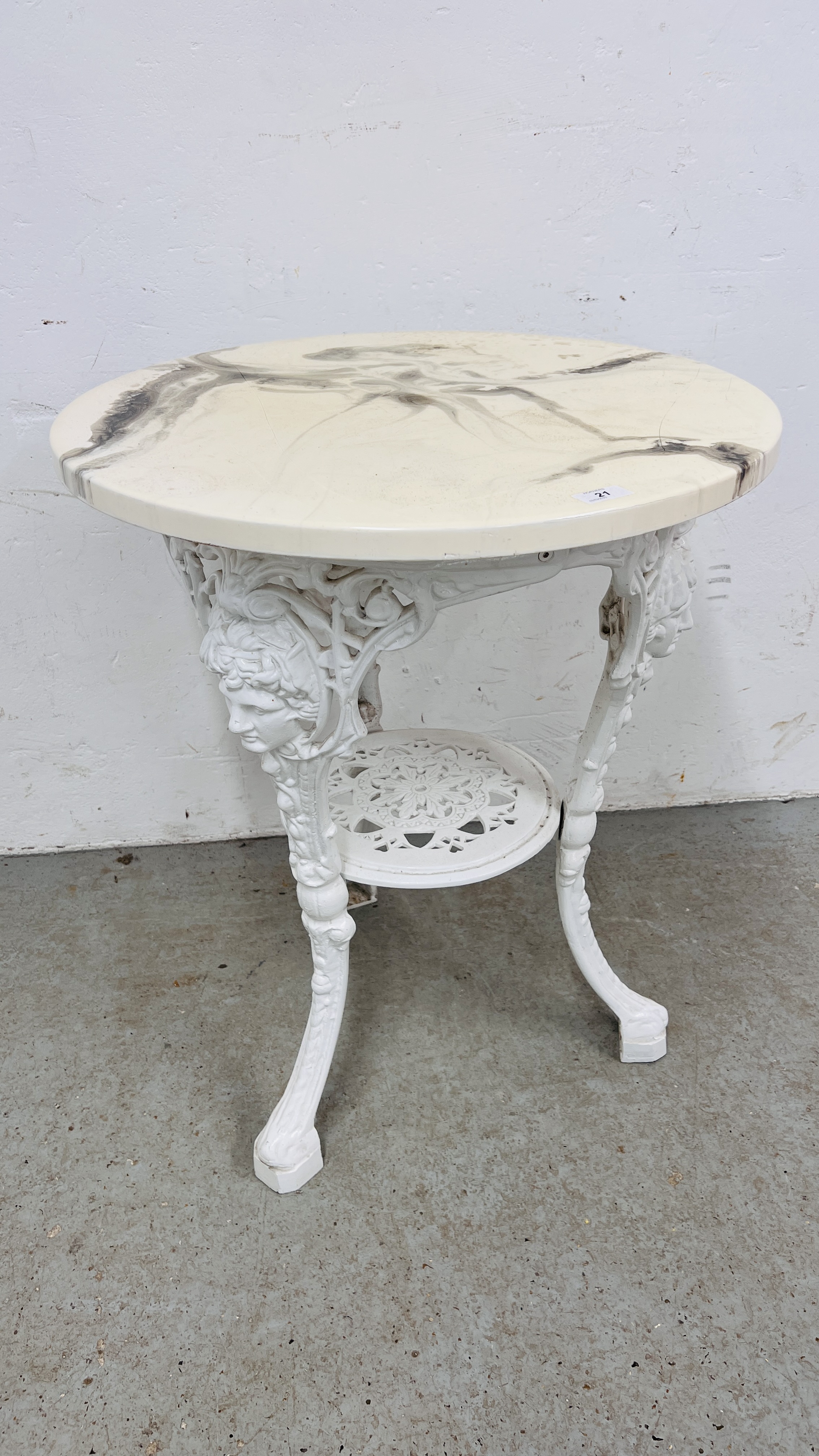 AN IRON PUB TABLE WITH FAUX MARBLE TOP