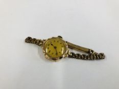 A LADIES 9CT GOLD WRIST WATCH ON A PLATED STRAP