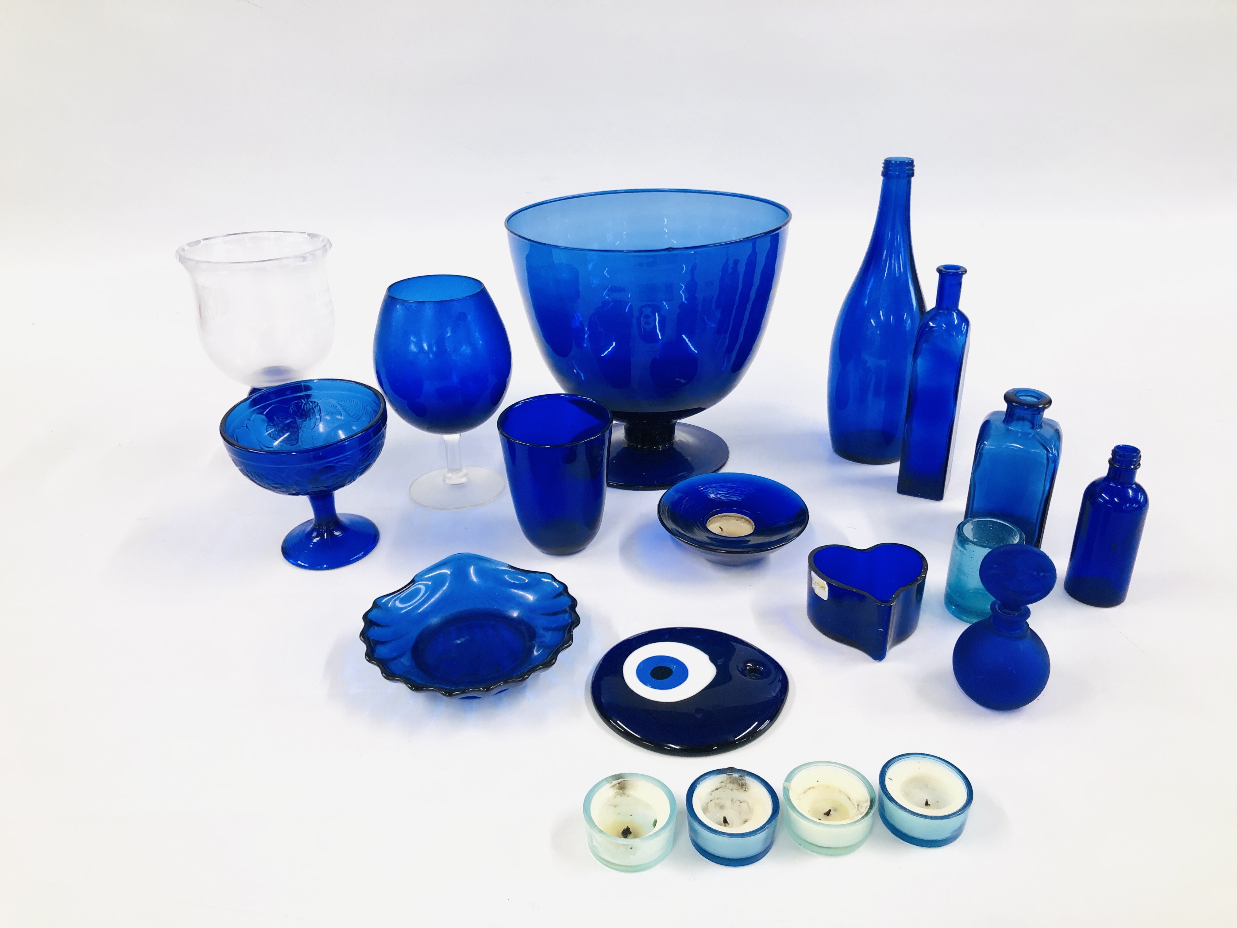 A COLLECTION OF BLUE STUDIO ART GLASS COMPRISING OFF VARIOUS BOTTLES,