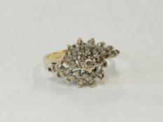 A 9CT GOLD DIAMOND CLUSTER RING.