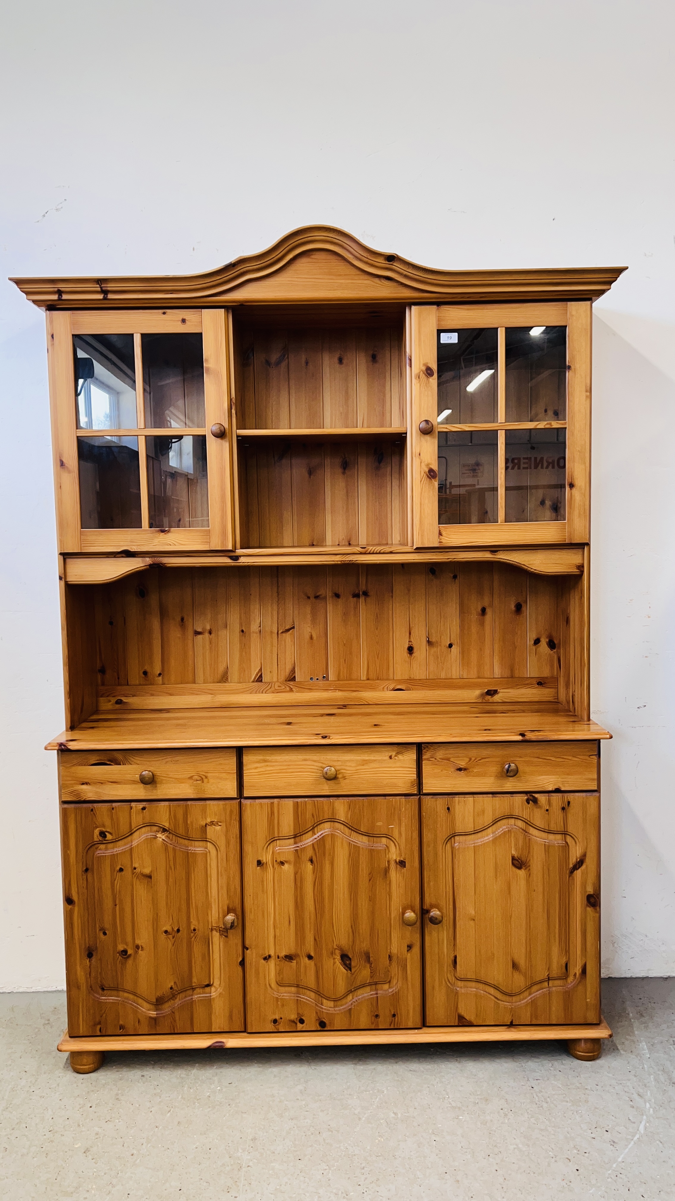 A HONEY PINE TRADITIONAL GLAZED TOP COUNTRY DRESSER, W 130CM, D 40CM, H 184CM.