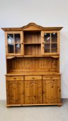 A HONEY PINE TRADITIONAL GLAZED TOP COUNTRY DRESSER, W 130CM, D 40CM, H 184CM.