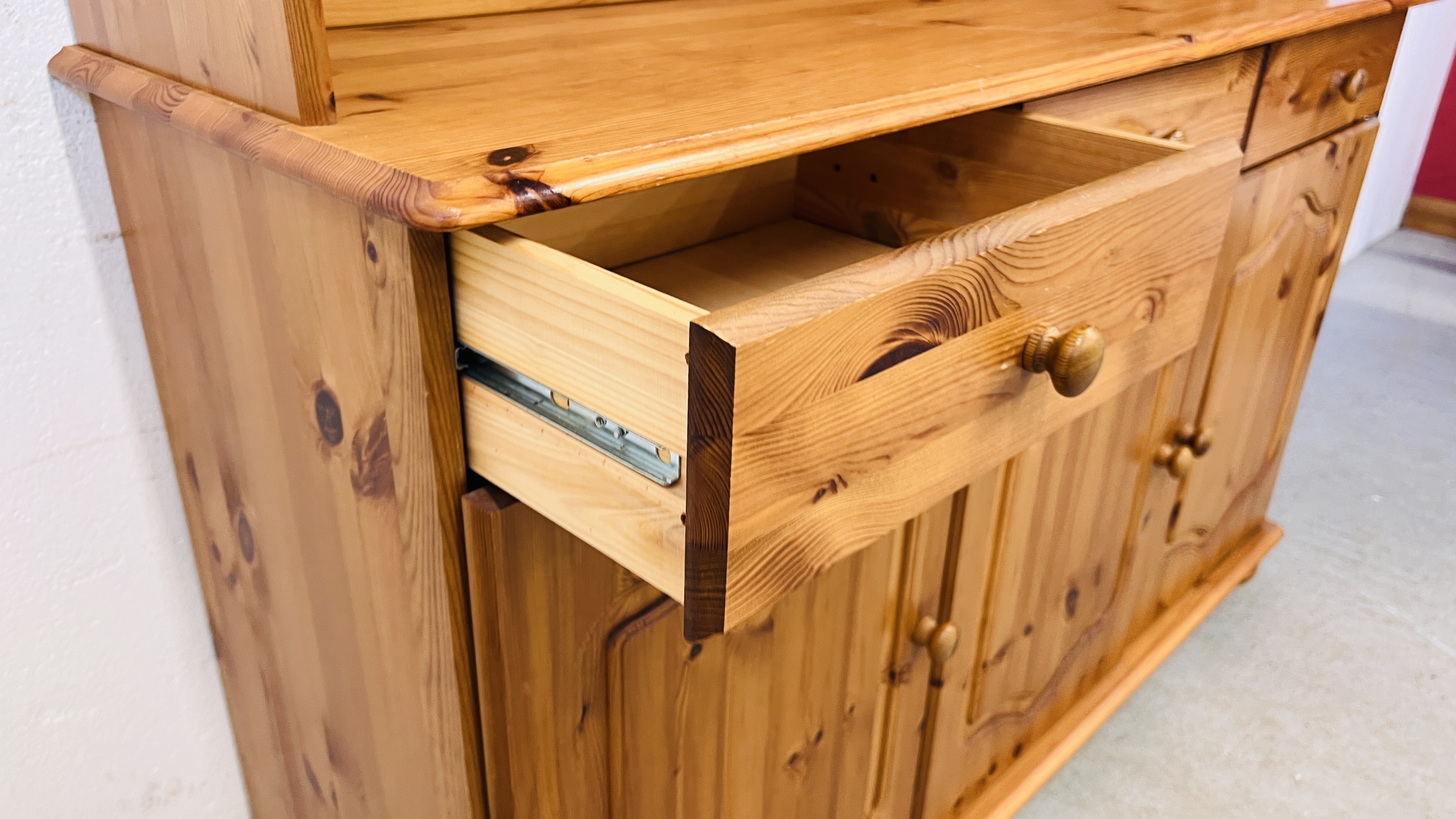 A HONEY PINE TRADITIONAL GLAZED TOP COUNTRY DRESSER, W 130CM, D 40CM, H 184CM. - Image 10 of 12