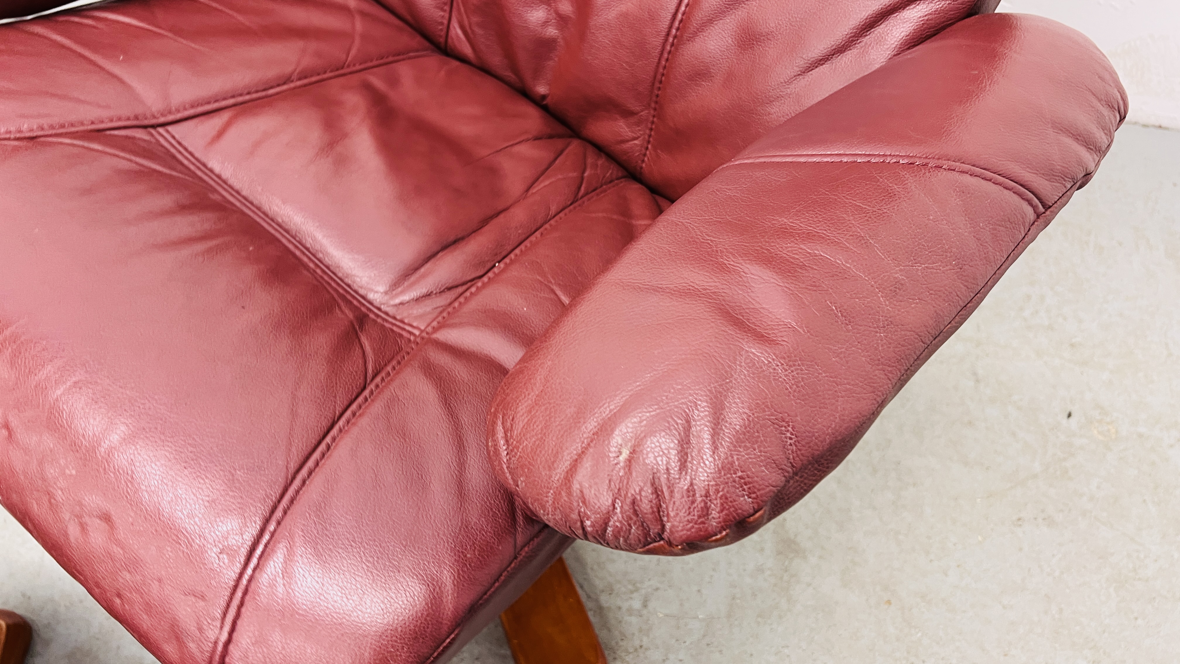 A PAIR OF RED LEATHER REVOLVING ARMCHAIRS WITH FOOTSTOOLS. - Image 17 of 25