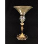 A VENETIAN GLASS WITH CONICAL BOWL, THE STEM WITH WHITE METAL COLLAR, 25.5CM HIGH.