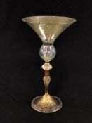 A VENETIAN GLASS WITH CONICAL BOWL, THE STEM WITH WHITE METAL COLLAR, 25.5CM HIGH.