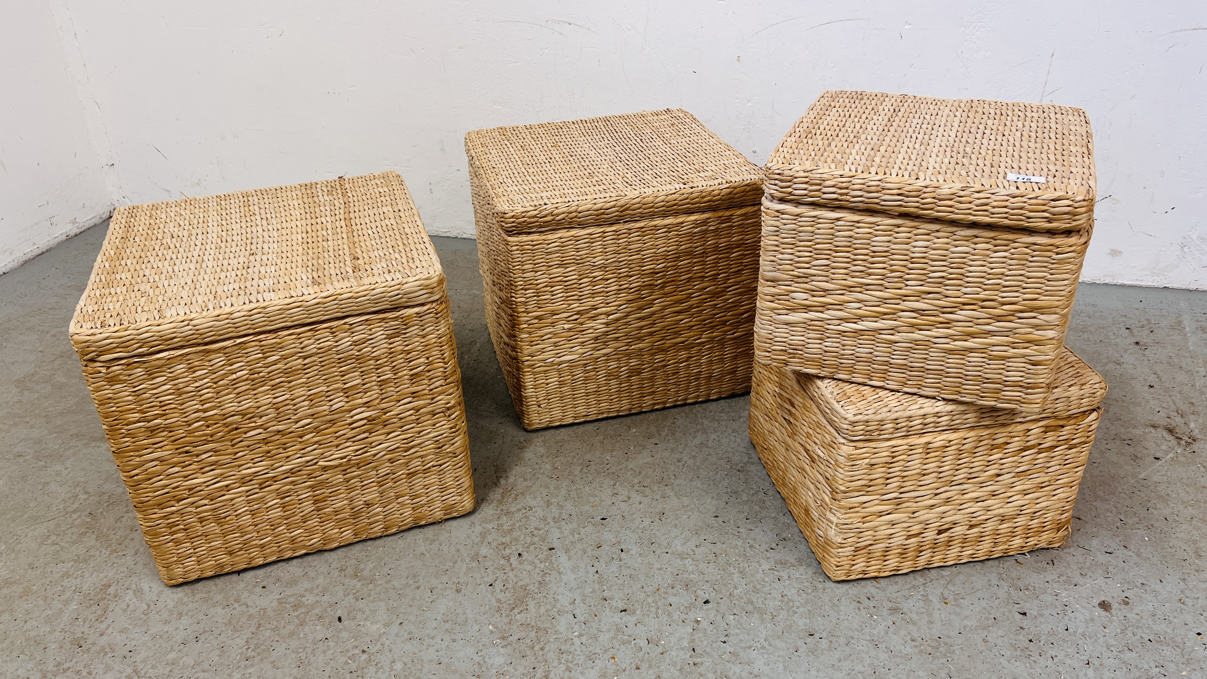 A SET OF 4 SEA GRASS STORAGE BOXES.