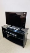 A SONY FLATSCREEN 32" TELEVISION SET WITH STAND MODEL KDL-32WD756. - SOLD AS SEEN.