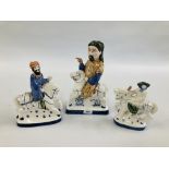 A RYE POTTERY FIGURE OF GEOFFREY CHAUCER ALONG WITH THE KNIGHT AND THE WIFE OF BATH.