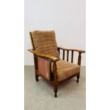 A 1930'S OAK EASY CHAIR WITH FOLDING BACK SECTION AND FOLDING SIDE TABLE.