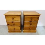 A PAIR OF PINE THREE DRAWER BEDSIDE CHESTS.