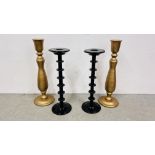 A PAIR OF TURNED GILDED CANDLESTICKS, 88CM.