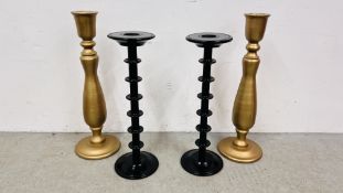 A PAIR OF TURNED GILDED CANDLESTICKS, 88CM.